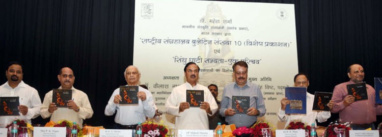 minister of state for culture dr. mahesh sharma releasing a book